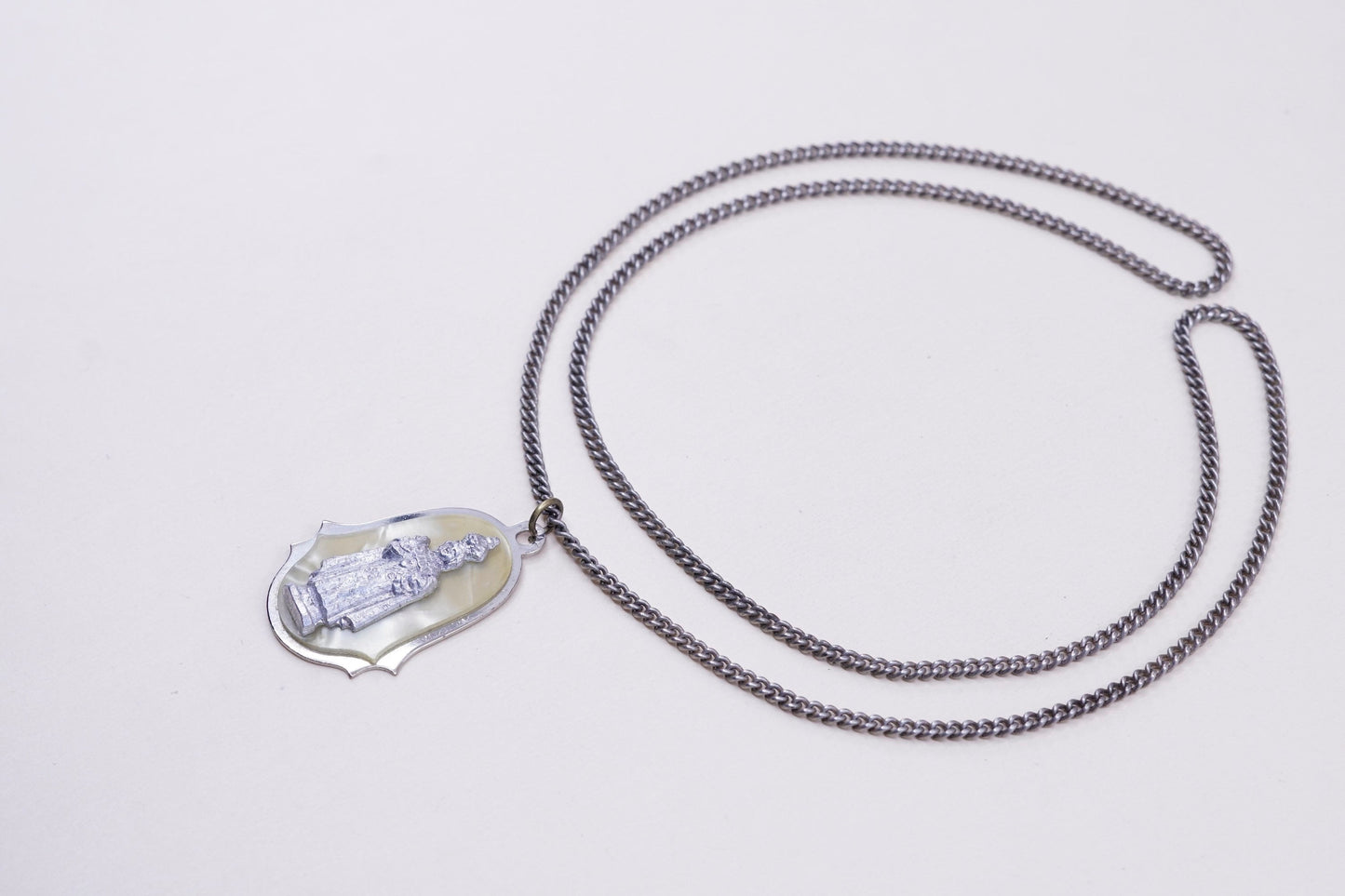 24”, vintage silver tone necklace with “queen” pendant