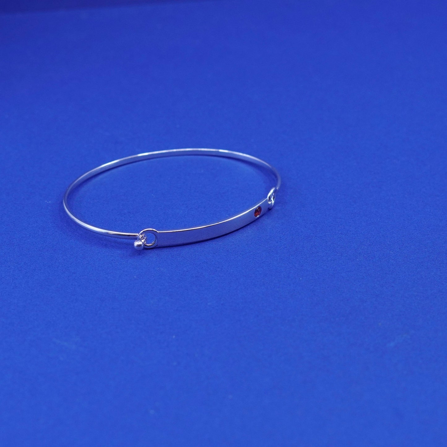7.5”, Elle Sterling silver bracelet, 925 matted glitter hinged bangle with ruby
