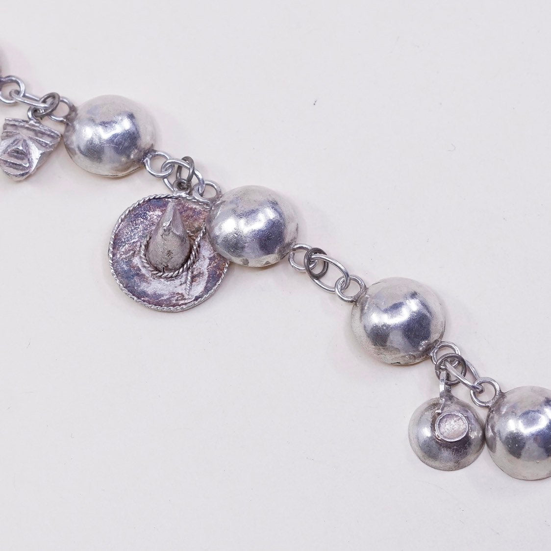 6”, sterling silver Handmade circle bracelet w/ hammer pot hat key sombrero