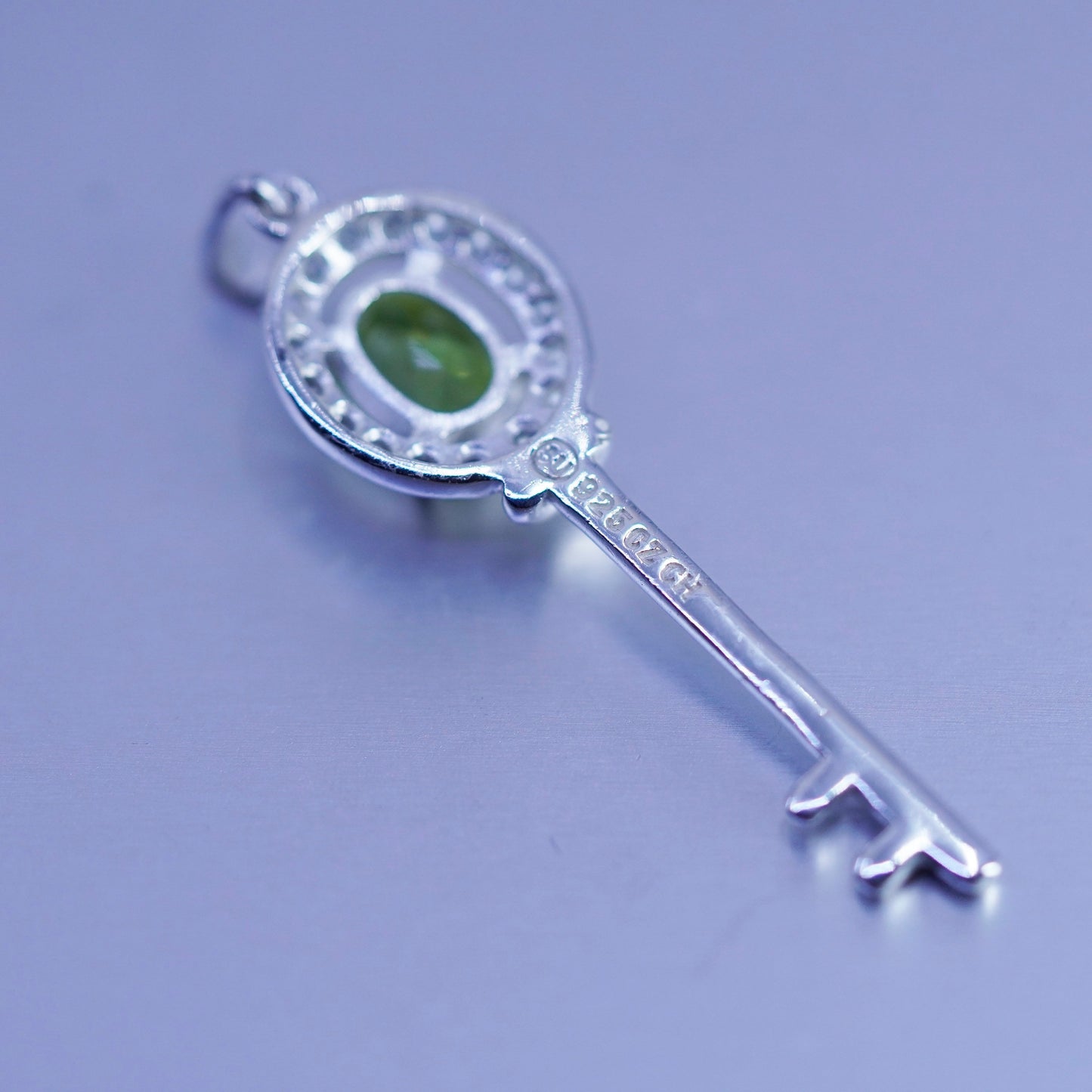 Vintage sterling 925 silver key pendant with peridot and cz
