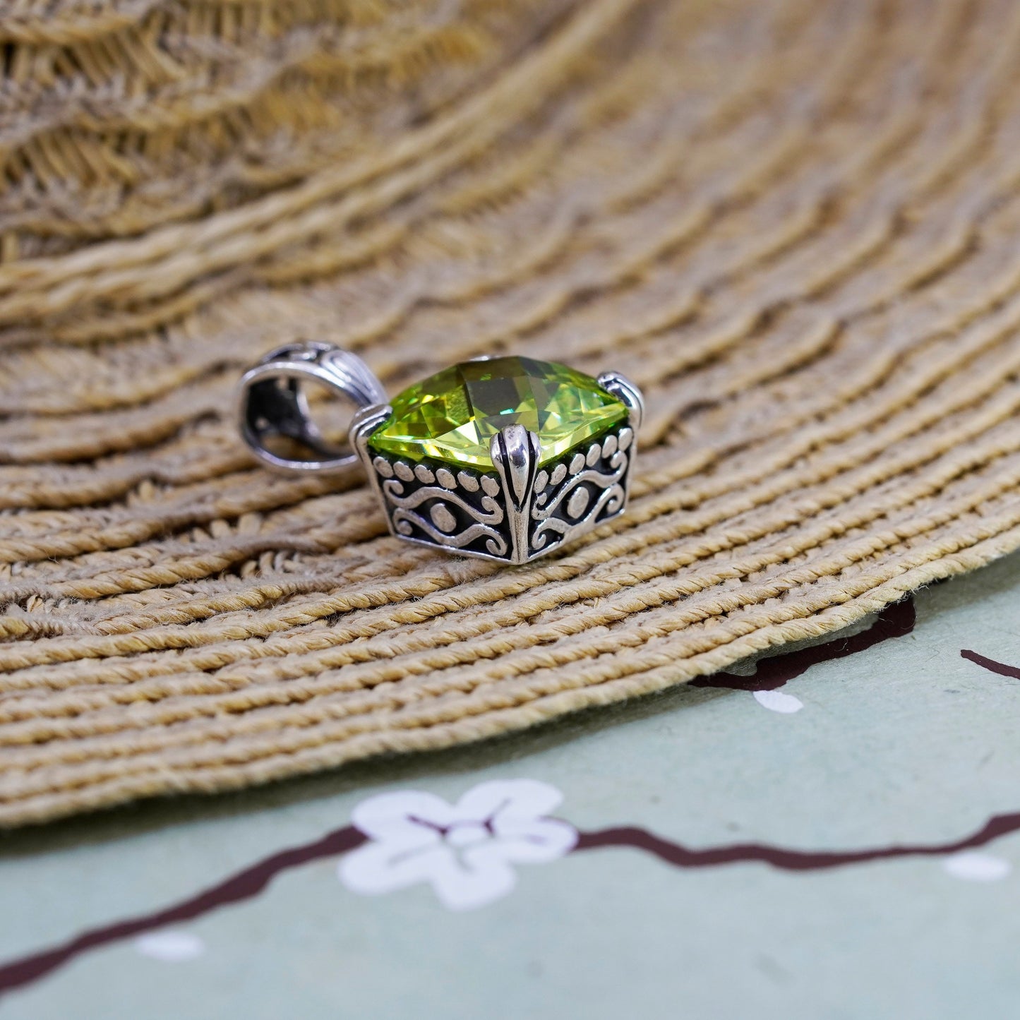Vintage Sterling 925 silver pendant with peridot evil eye embossed on the side