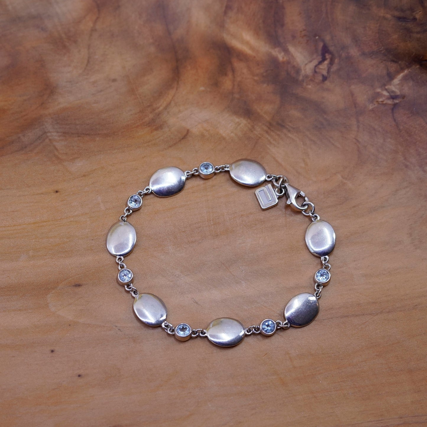 7.25”, Sterling silver bracelet, 925 oval chain with 10K gold charm and topaz