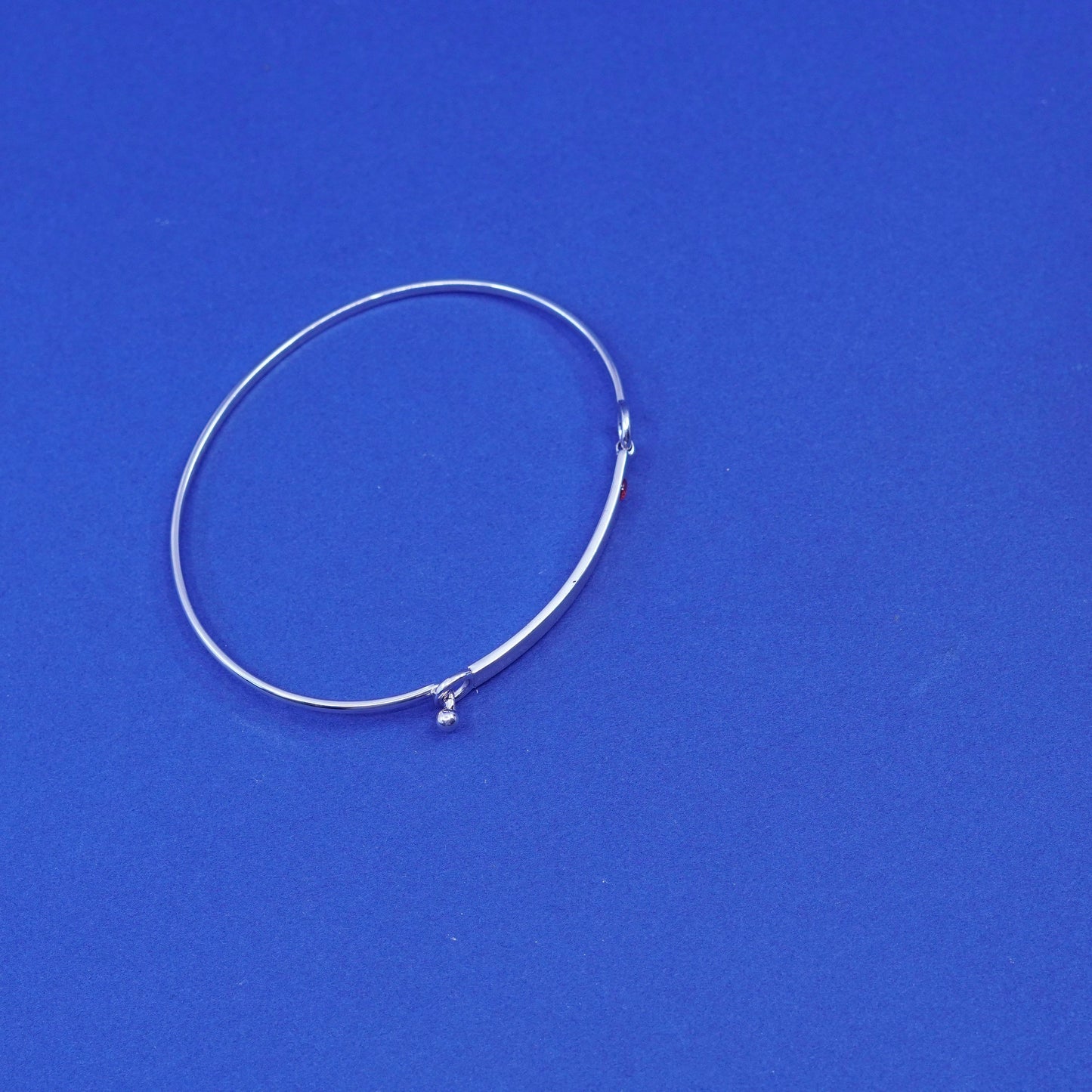 7.5”, Elle Sterling silver bracelet, 925 matted glitter hinged bangle with ruby