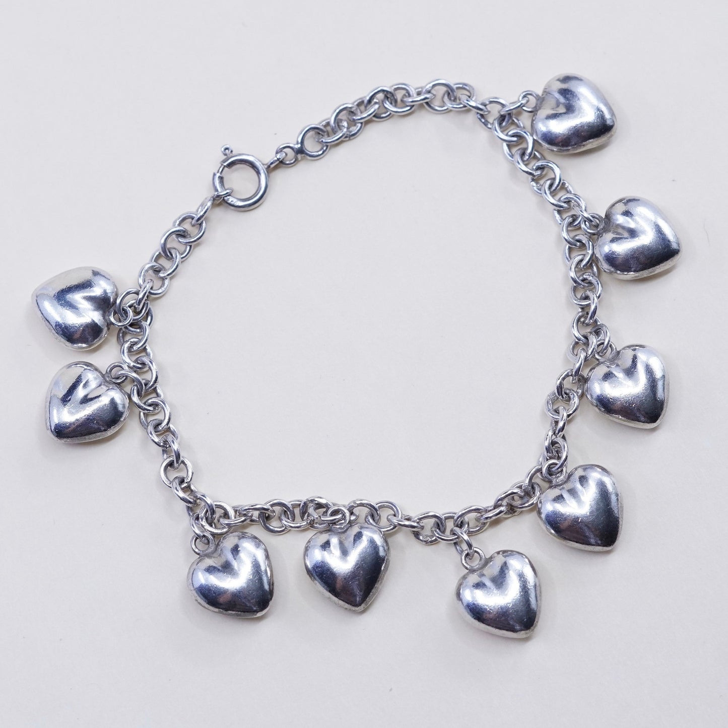 7.75”, 3mm, vtg JCM sterling 925 silver circle bracelet w/ cluster heart charms