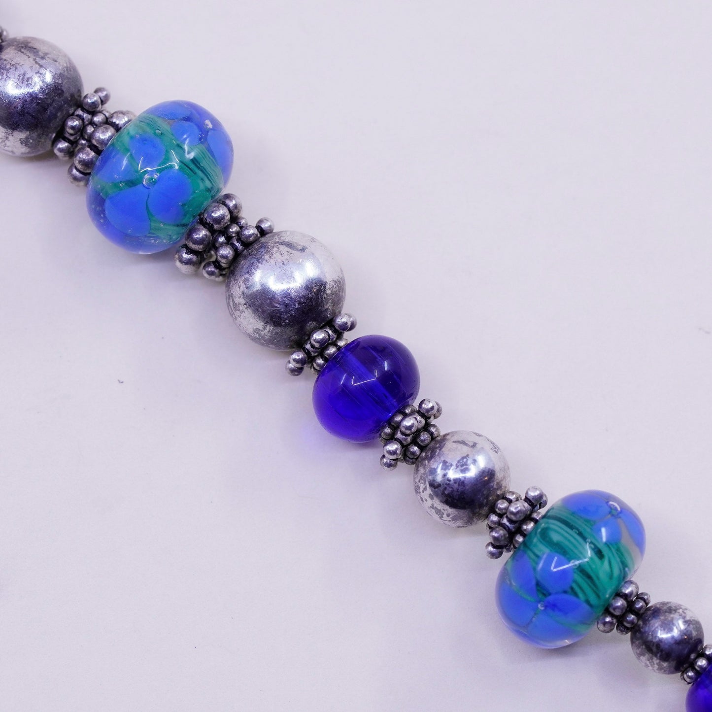7.75”, vintage 925 Sterling silver bracelet with artisan blue glass beads