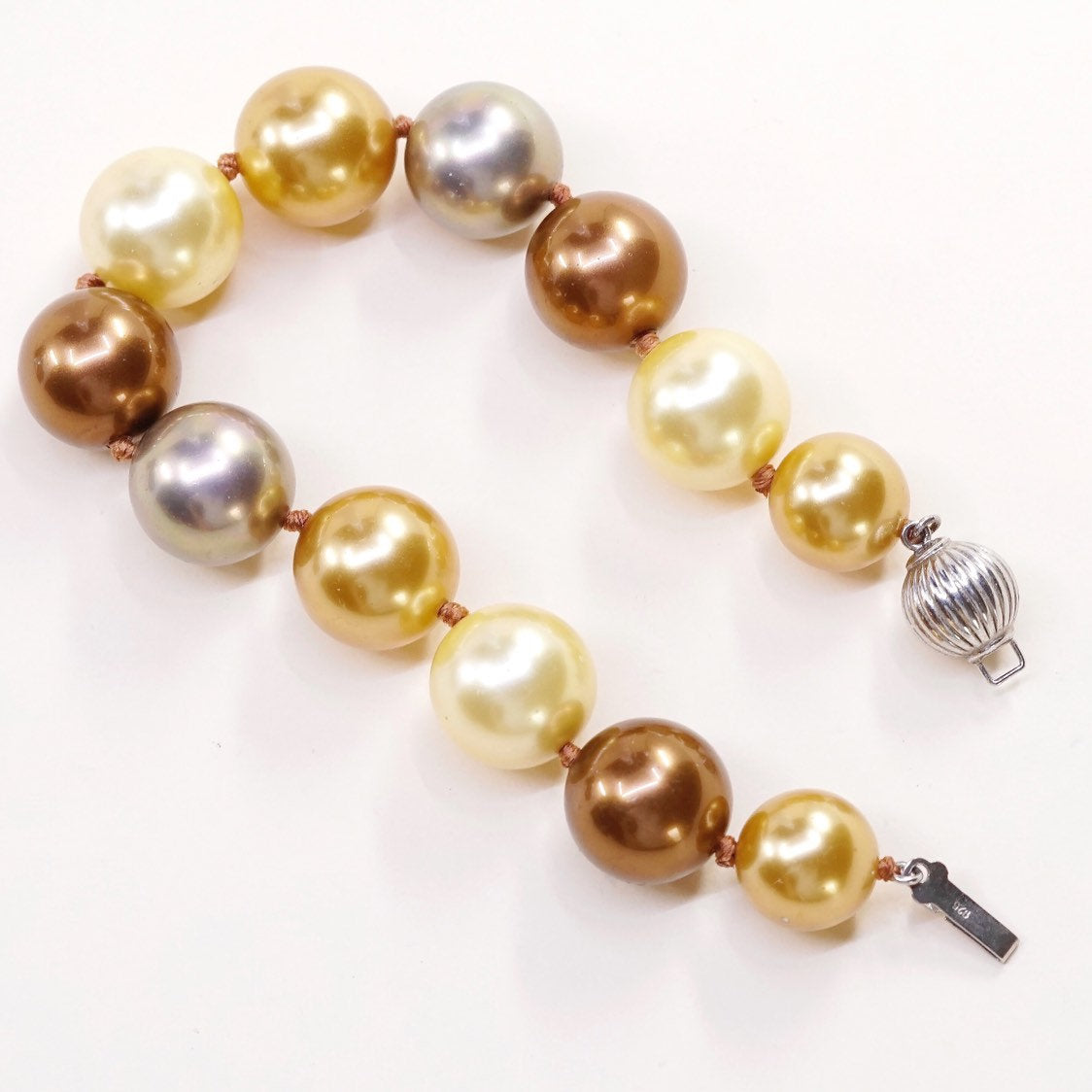 6.5”, Vintage handmade bracelet, gold and earth tone pearl beads w/ 925 clasp
